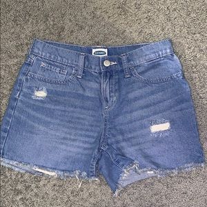 blue ripped jean shorts.